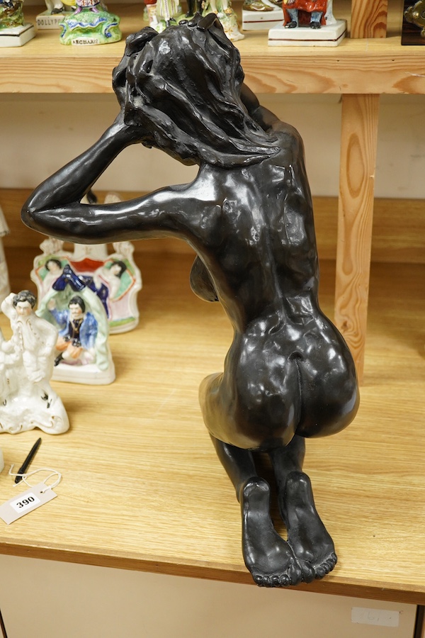 A bronzed composition model of a kneeling female nude, 53cm. Condition - good